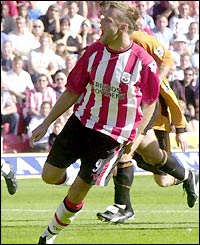 James Beattie celebrates scoring from the spot 