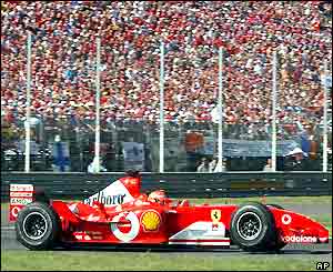 Schumacher holds on for a crucial victory roared on by the passionate Italian crowd