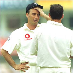 Nasser Hussain wipes his brow as he talks to Darren Gough during the 2001 Ashes series