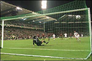 Zidane scores in the penalty-shoot out against Portugal in Euro 2000 to help France reach the final