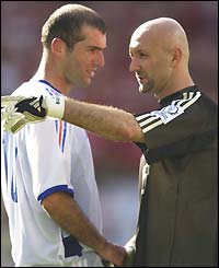 Zinedine Zidane is comforted by Fabien Barthez