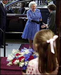 Esme Goudie, 6, waits to present the Queen with a posy
