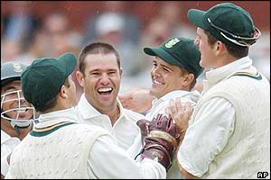 Andrew Hall celebrates the dismissal of Nasser Hussain as England struggle at Lord's