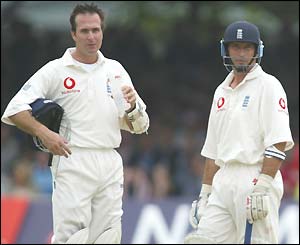 England captain Michael Vaughan has a drink as he takes a break with his predecessor Nasser Hussain