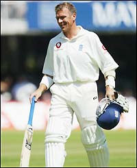 Alec Stewart leaves the pitch at Lord's for the final time in his international career