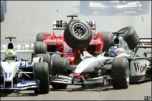 Ralf Schumacher, Barrichello and Raikkonen crash before the first corner