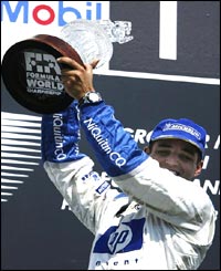 Montoya collects the winners trophy