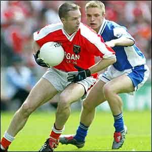 Armagh's Andrew McCann and Laois midfielder Ross Munnelly