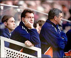 Glenn Hoddle leans against the dug out as during his side's 5-1 defeat to Middlesbrough