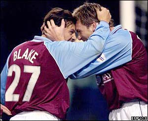 Burnley players celebrate scoring against Tottenham in the 2003 Worthington Cup third round