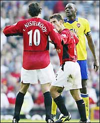 Van Nistelrooy and Vieira square up during the match