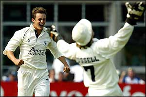 Gloucester's Alex Gidman celebrates taking the wicket of Derbyshire's Chris Bassano
