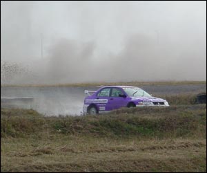 Dust was kicked up as the cars sped around the track