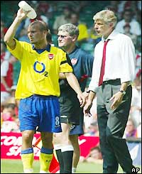 Freddie Ljungberg takes a water break in soaring temperatures in Cardiff