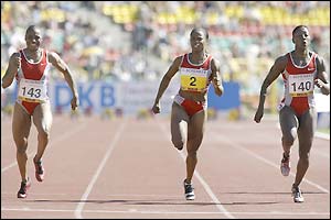 Chryste Gaines and Chandra Sturrup are beaten by American Kelli White in the 100m