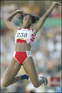 Denise Lewis competes in the long jump