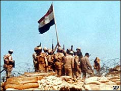 Egyptian soldiers raise a flag on Bar-Lev line bunker in Sinai