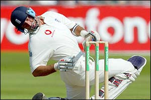 Nasser Hussain falls after he is hit on the side of the head by Makhaya Ntini's bouncer