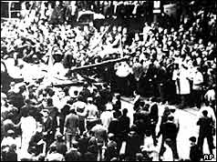 Crowds surround a Soviet tank