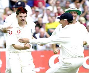 James Anderson is congratulated by his team-mates after bowling Jacques Kallis