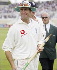 Michael Vaughan carries a stump off the pitch