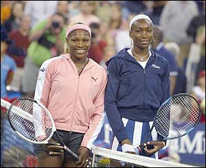 Serena Williams and her sister Venus line up before the start of their final