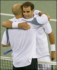 Andre Agassi hugs Pete Sampras after losing the US Open final