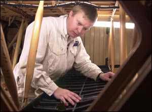 Engineer fitting Kevlar lining to a Concorde fuel tank