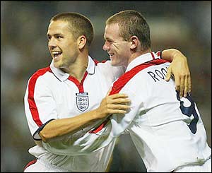 England's Wayne Rooney congratulates Michael Owen as the Liverpool striker scores against Liechtenstein at Old Trafford 