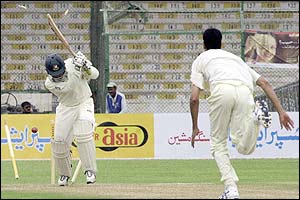 Pakistan's Omar Gul bowls Bangladesh's Javed Omar 