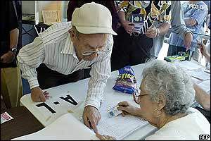 A voter checks for his name