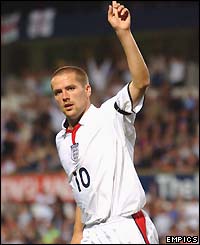 Michael Owen sticks his finger in the air to celebrate scoring England's second