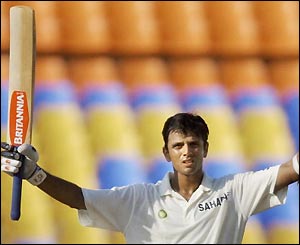 India's Rahul Dravid raises his arms to celebrate his century