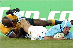 Australian wing Sailor fails to stop Argentinian winger Ignacio Corleto scoring in the corner 