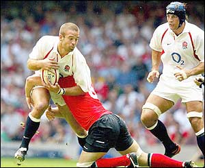 England's Joe Worsley takes a crunching tackle