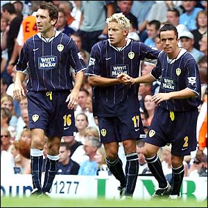 Alan Smith is congratulated by his team-mates after scoring for Leeds