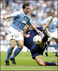 Robbie Fowler is thwarted by the Portsmouth defence