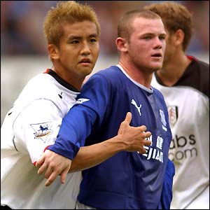 Fulham's Junichi Inamoto keeps a close eye on Everton wonderkid Wayne Rooney