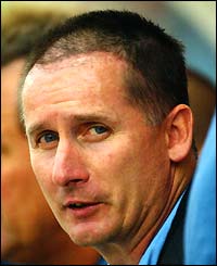Glenn Roeder returns to the dug out during a pre-season friendly at Bournemouth