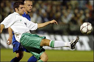 Northern's Ireland Aaron Hughes kicks the ball 