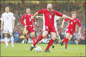 Wales' John Hartson scores from the penalty spot