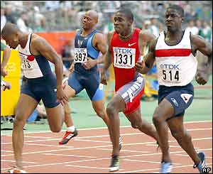 Britain's Dwain Chambers (right) wins his semi-final heat