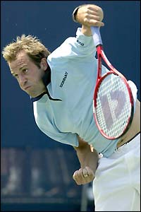 Britain's Greg Rusedski serves