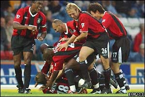 Manchester City players celebrate Michael Tarnat's goal