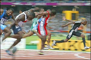 Kim Collins wins the 100m title