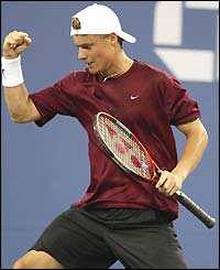Sixth-seeded former champion Lleyton Hewitt celebrates beating Victor Hanescu of Romania