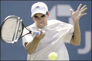 Ramon Delgado plays a forehand on his way to beating Sebastien Grosjean