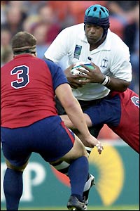 Fiji's Api Naevo pushes through the USA defence