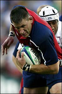 The United States' Luke Gross test the Fijian defence