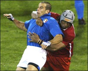 Tonga's Ipolito Fenukita produces a dangerously high tackle and is yellow carded